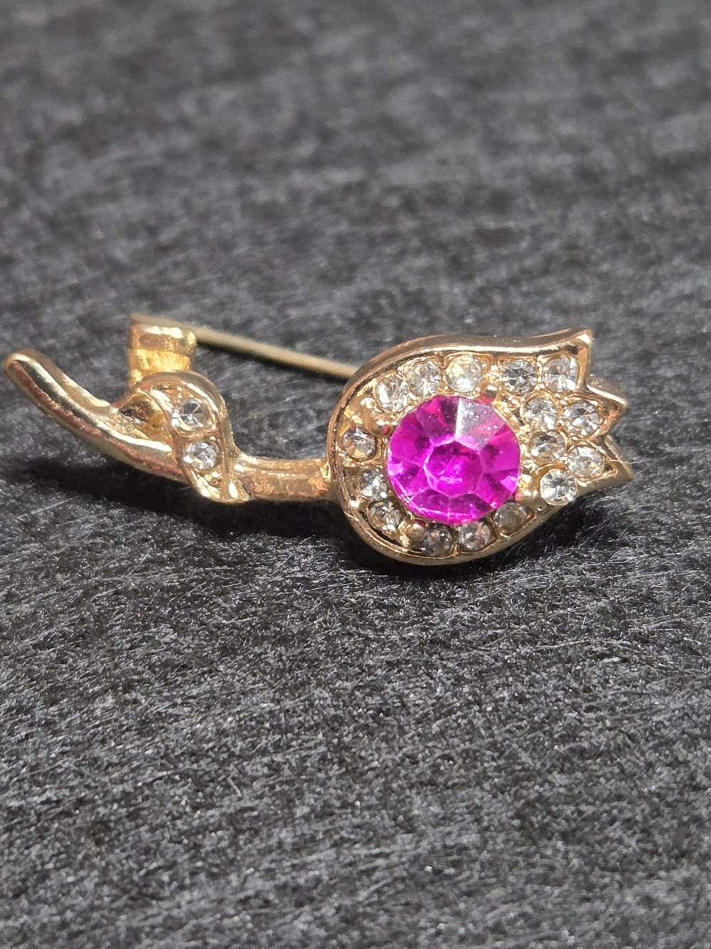 **Gold-Tone Swan Brooch with Pink Crystal Center**